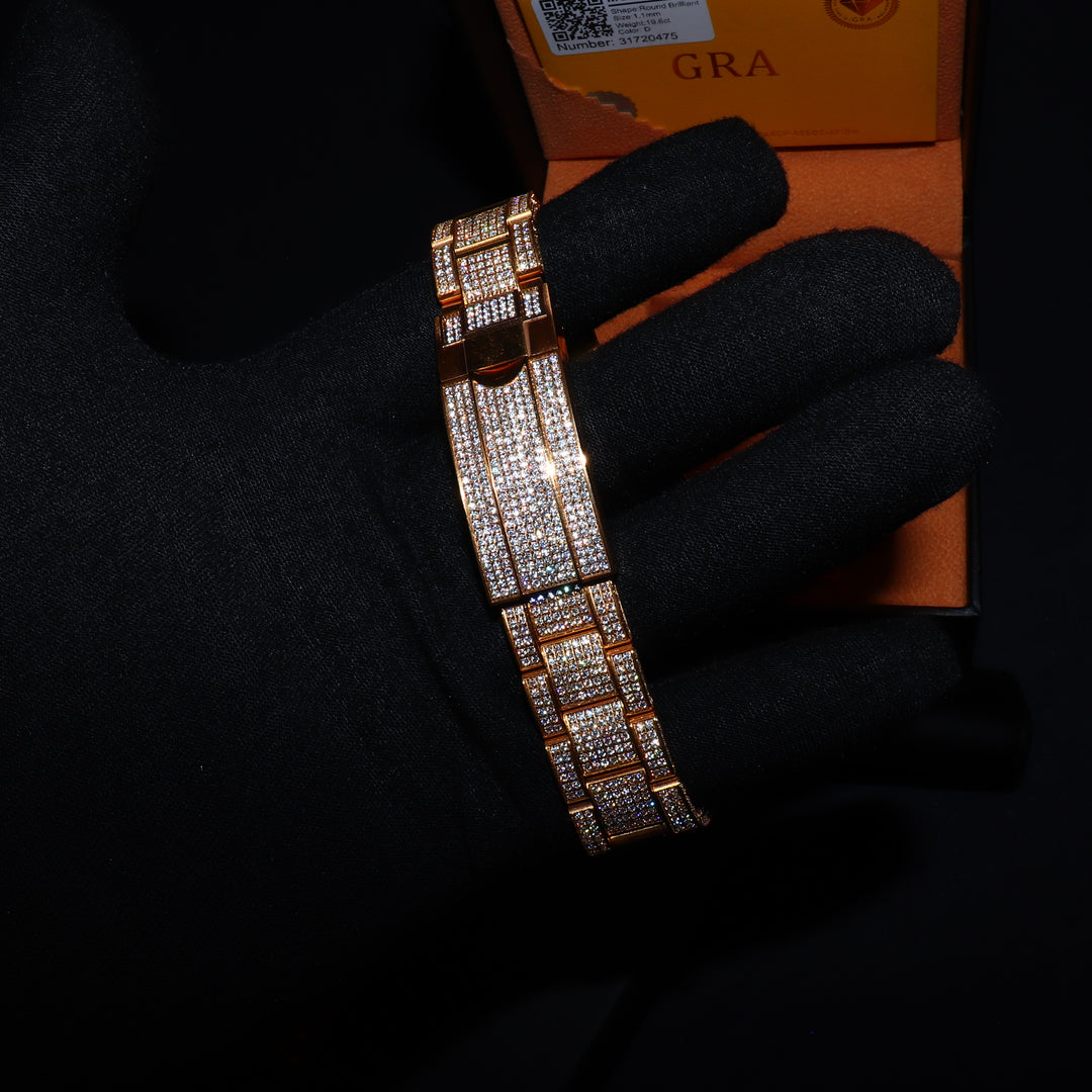 Fully iced VVS1 Corore watch with gold band and Roman numeral dial from ICECLIQUE JEWELRY, featuring sparkling moissanite accents.