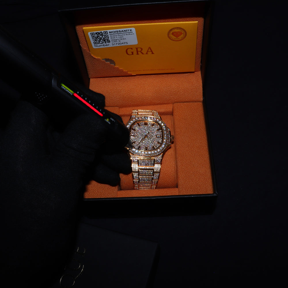 Square-shaped Fully Iced VVS1 Miami watch by ICECLIQUE Jewelry with gold band and moissanite accents, showcasing a luxurious jewelry piece.