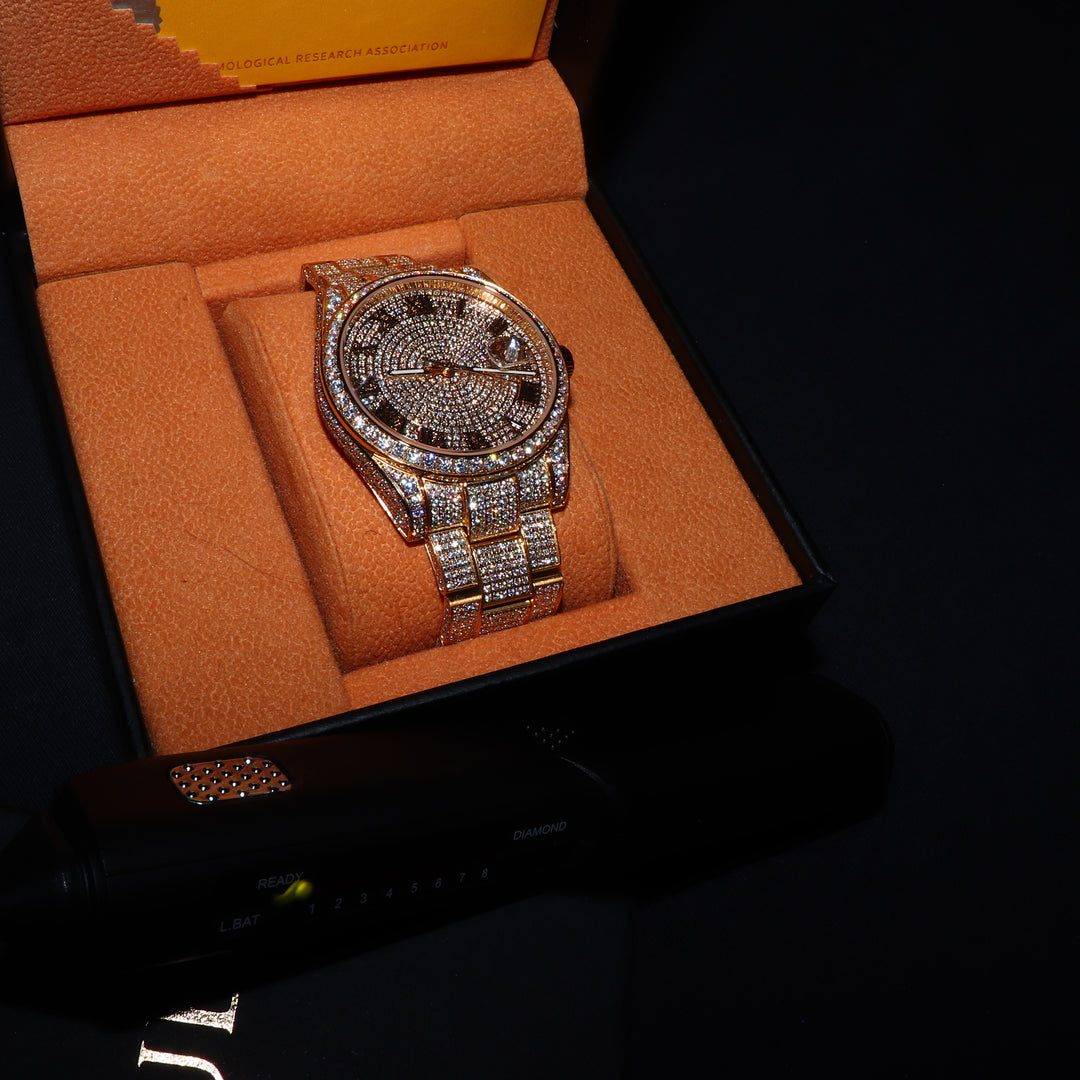ICECLIQUE Jewelry fully iced VVS1 Moissanite Corore watch with gold band and Roman numeral dial, showcasing luxurious elegance.