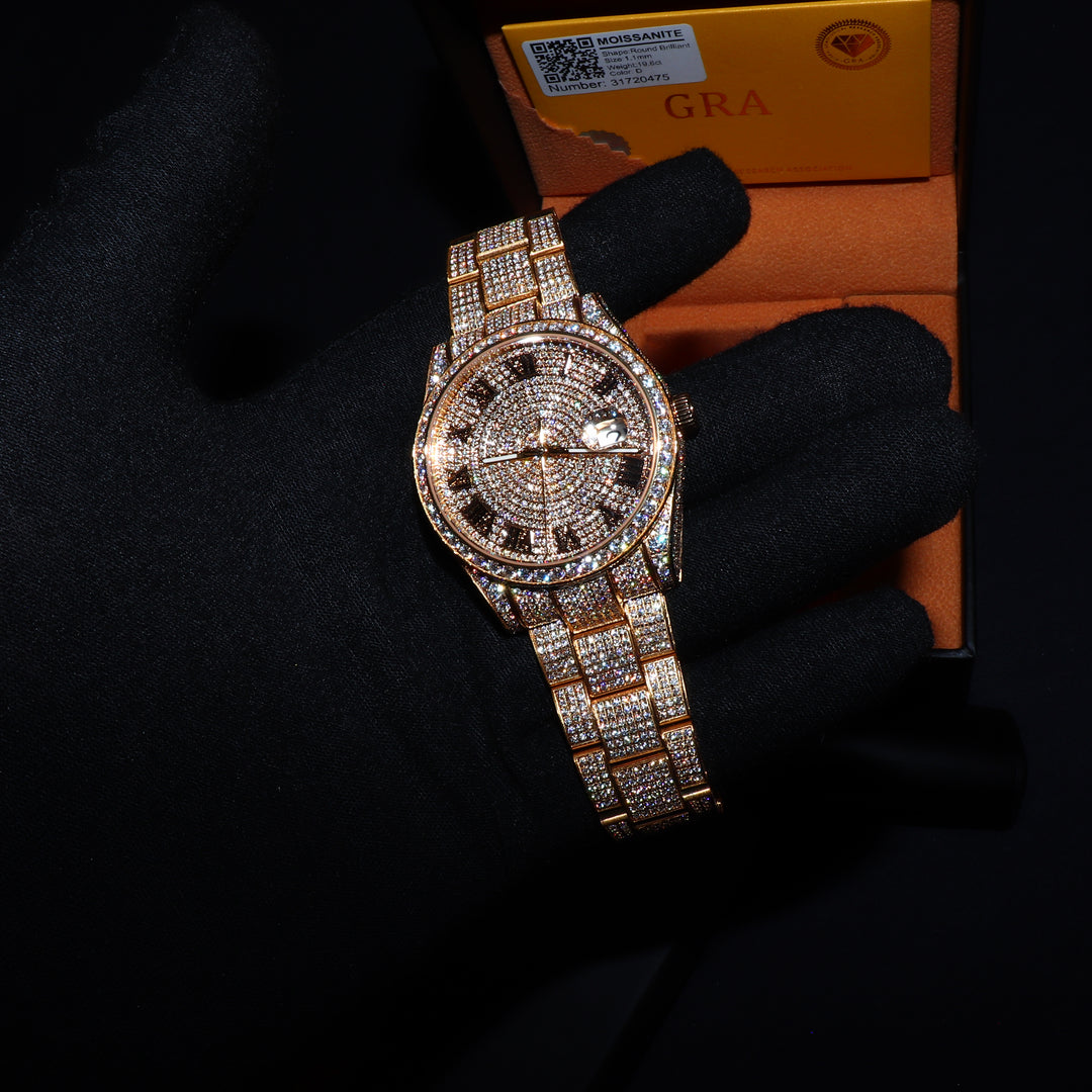 Fully iced VVS1 Corore gold watch with Roman numeral dial featuring moissanite accents by ICECLIQUE JEWELRY.